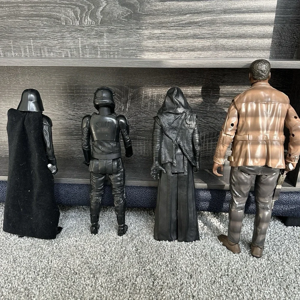 Star Wars action‎ figures Darth Vader, a TIE Fighter Pilot, Kylo Ren, and Finn